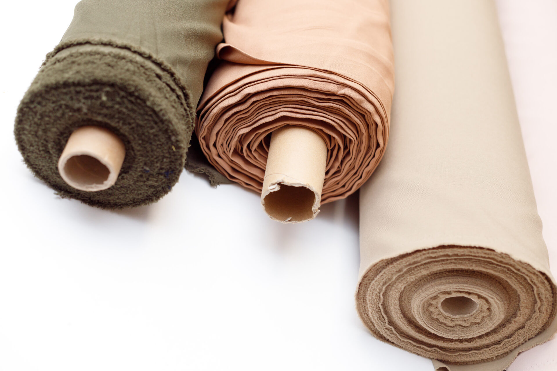rolls of pastel coloured fabric