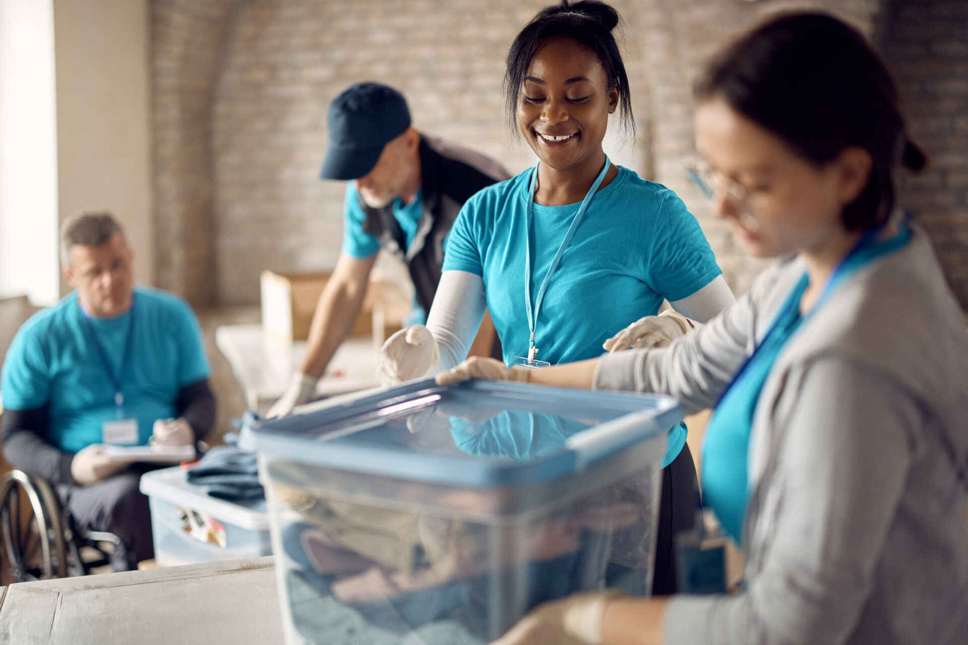 volunteers packing clothes into boxes