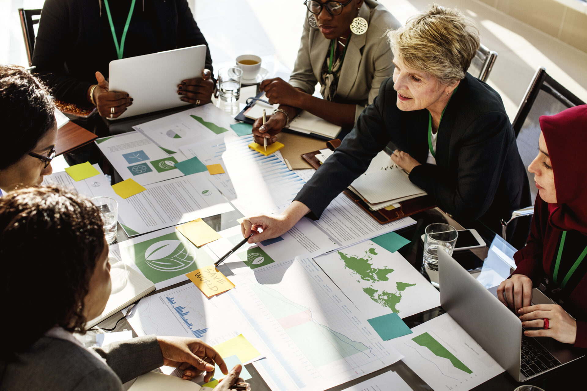 Business people around a table discussing sustainability