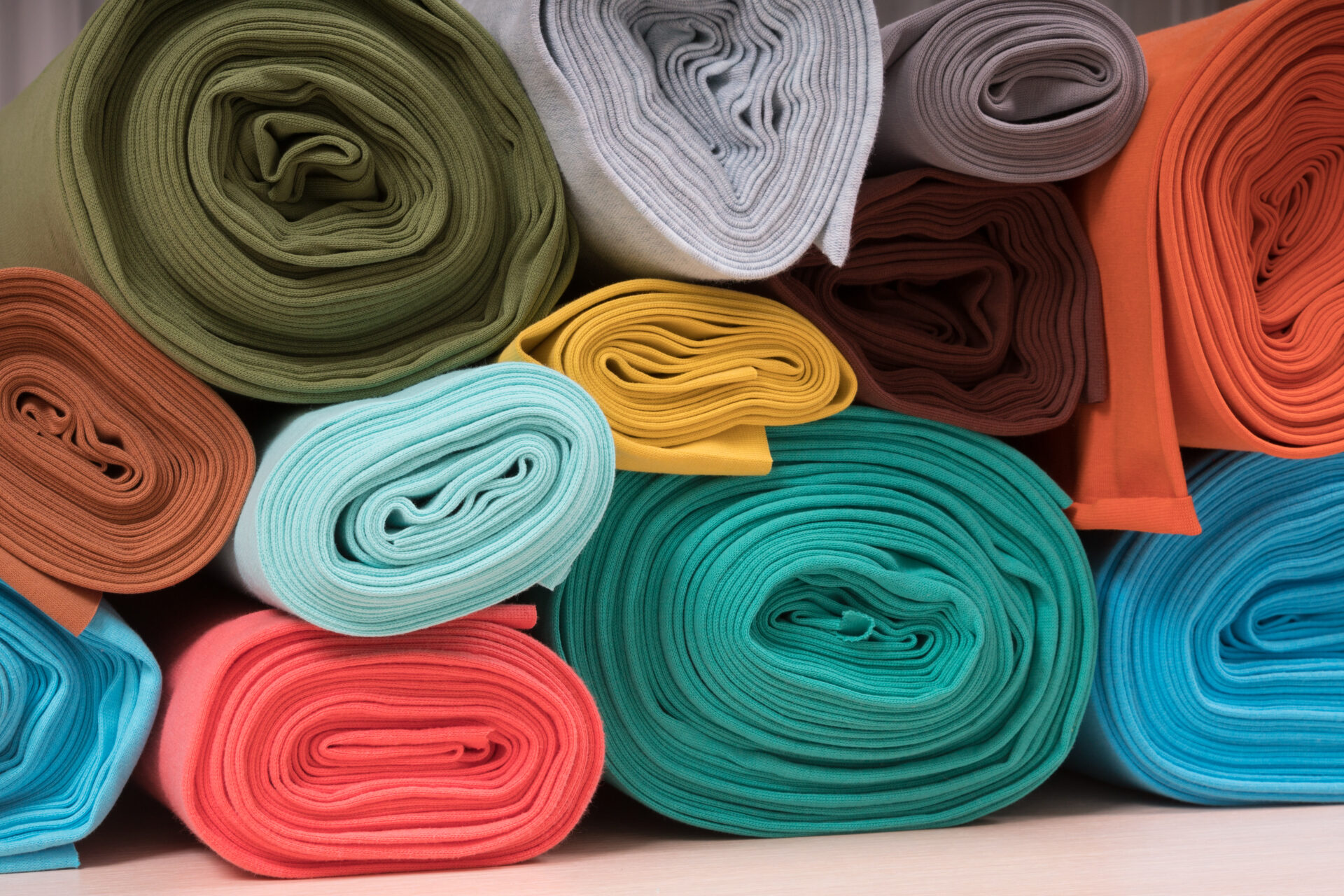 rolls of coloured fabric
