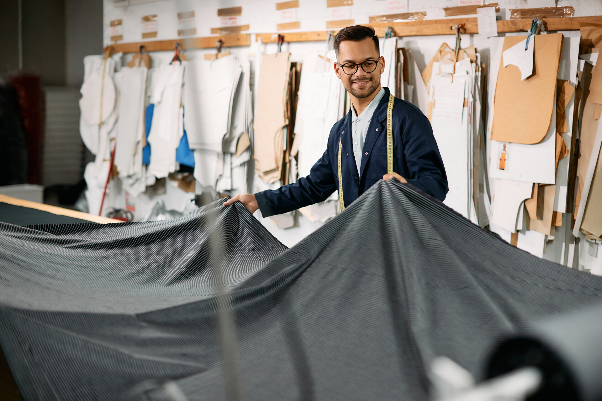 textile worker looking at modern fabric