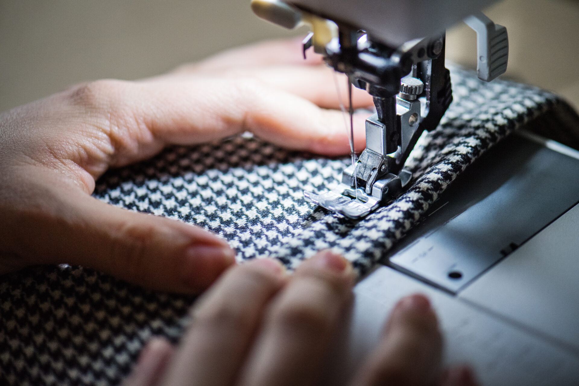 woman using sewing machine